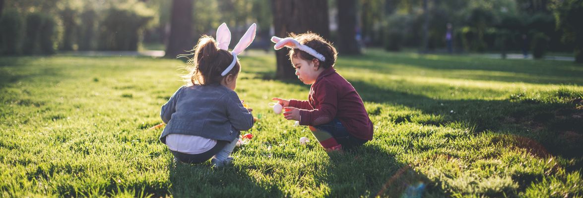 Easter egg hunt in the garden with children