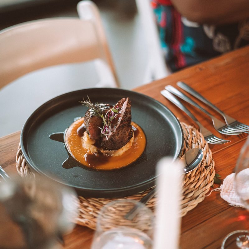 A delicious steak with on a fine dining style plat at Nyosi